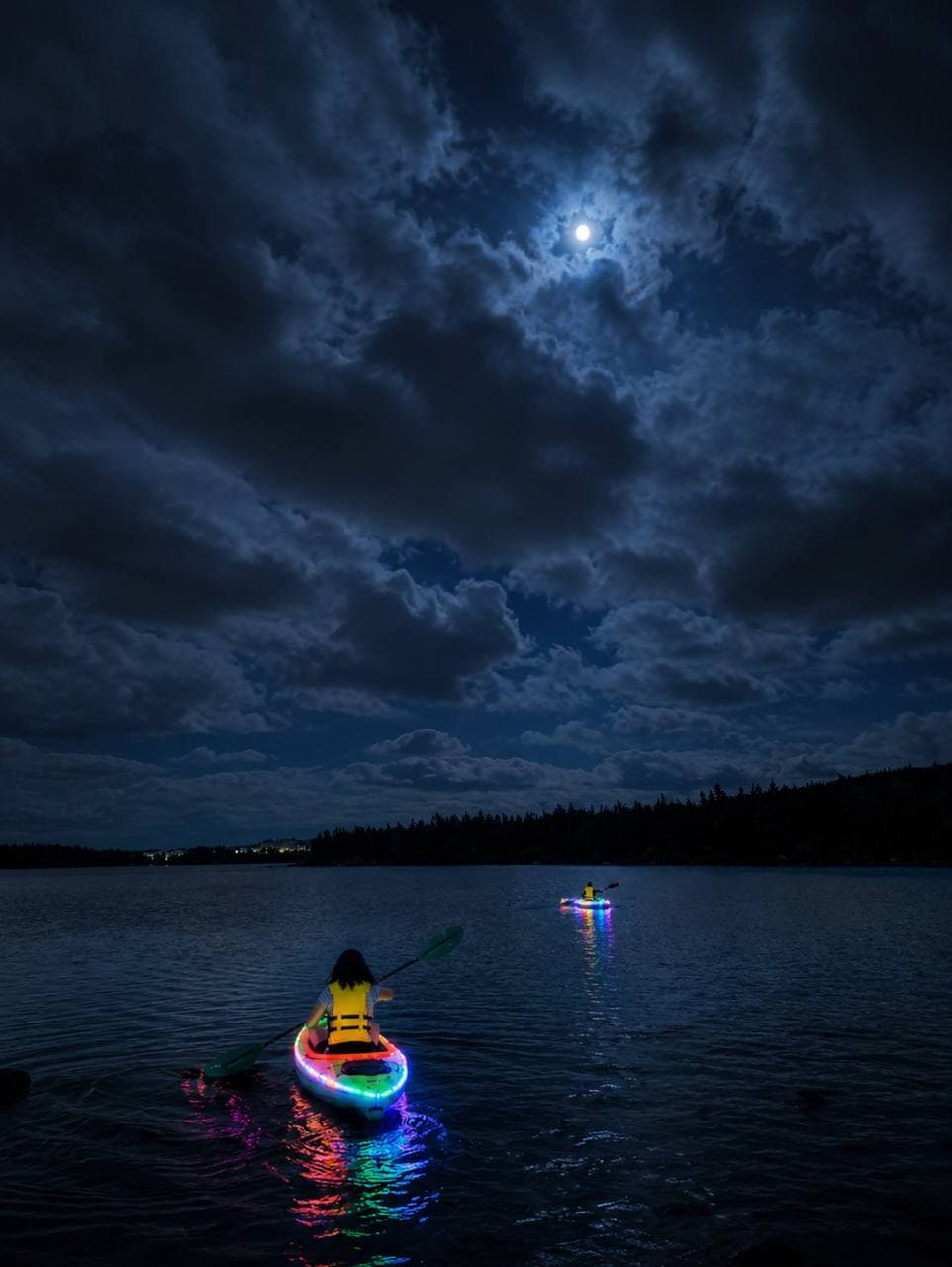 Paradise Paddles group and illuminated private event photo.