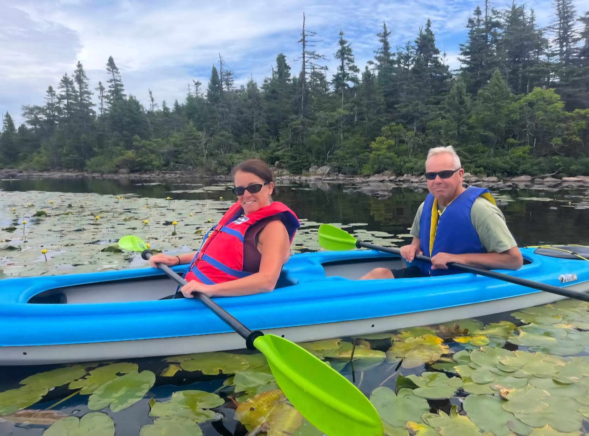 A couple kayaking together on Neil's Pond near St. John's, Newfoundland.